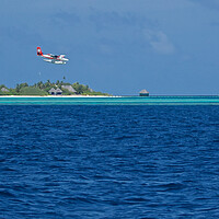 Buy canvas prints of Sea plane landing on water in Maldives by mark humpage