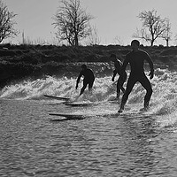 Buy canvas prints of Surfers riding a wave on the river Severn by mark humpage