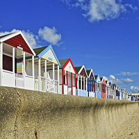 Buy canvas prints of Southwold Beach Huts and Sea Wall by Bill Simpson