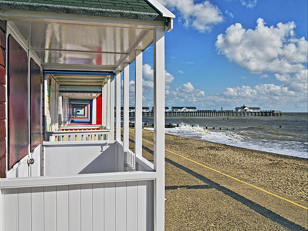 Southwold Pier Through Beach Huts Picture Board by Bill Simpson