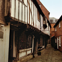 Buy canvas prints of Tudor Terraces Devizes England by Carole-Anne Fooks