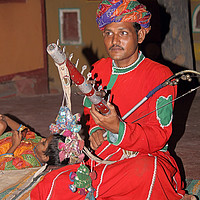 Buy canvas prints of Musician at the Chocki Dani Village in Rajasthan,  by Carole-Anne Fooks