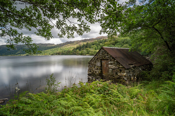 Serene Stone Boathouse on Llyn Gwynant Picture Board by Pam Sargeant