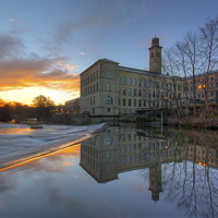 Buy canvas prints of Sunrise at Salts Mill by Andrew Holland