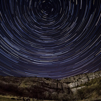 Buy canvas prints of  Malham Cove Star Trails by Andrew Holland