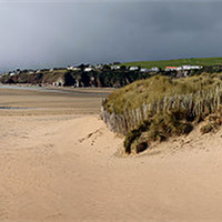 Buy canvas prints of Heavy rain clouds, Bantham Beach by James Rennick