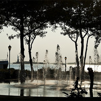 Buy canvas prints of Fountain Contra Jour, Battery Park NYC by Kenny Partington