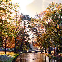 Buy canvas prints of Bourton on the Water Autumn Trees Cotswolds by Andy Evans Photos