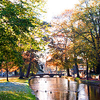 Buy canvas prints of Bourton on the Water Autumn Trees Cotswolds by Andy Evans Photos