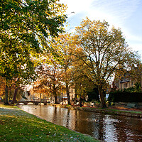 Buy canvas prints of Bourton on the Water Autumn Trees Cotswolds UK by Andy Evans Photos