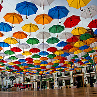 Buy canvas prints of "Vibrant Umbrella Canopy in Torrox" by Andy Evans Photos