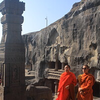 Buy canvas prints of Monks Pose for a Picture at the Ellora Caves by Aidan Moran