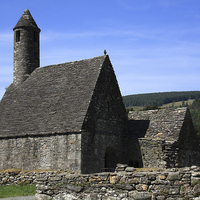 Buy canvas prints of  St Kevins Church And Round Tower by Aidan Moran