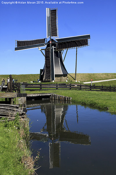  Windmill Reflection In A Pond  Picture Board by Aidan Moran