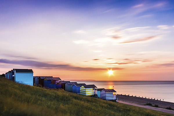 Beach Huts at Sunset Picture Board by Ian Hufton