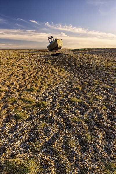 lone boat on Dungeness beach Picture Board by Ian Hufton