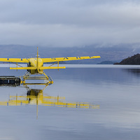 Buy canvas prints of Flying over Loch Lomond by John Hastings