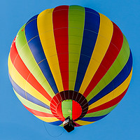 Buy canvas prints of Serene Striped Balloon Soaring by John Hastings