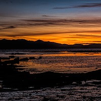 Buy canvas prints of Awe-Inspiring Sunset Over the Isle of Arran by John Hastings
