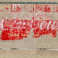 Buy canvas prints of Faded Coca Cola Sign on Tenement Wall by John Hastings