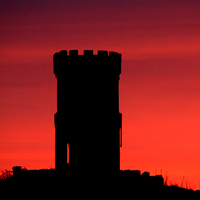 Buy canvas prints of  Red watch tower at night. by Jim Moran