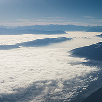 Buy canvas prints of Mountains rising from the clouds by Nick Hirst