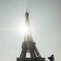 Buy canvas prints of Sun shining through the Eiffel Tower by Nick Hirst