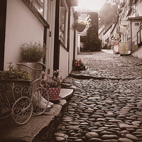 Buy canvas prints of Clovelly Cobbled Street by Adam Payne