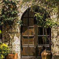 Buy canvas prints of A Shadowy Door in Saint Paul de Vence, France. by Maggie McCall