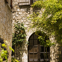 Buy canvas prints of A Shadowy Door and Alley in Saint Paul de Vence Fr by Maggie McCall