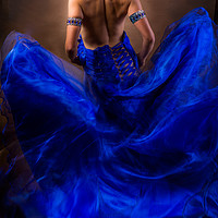 Buy canvas prints of Woman In A Billowing Blue Gown by Maggie McCall