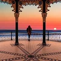 Buy canvas prints of Silhouette of girl  on Brighton Bandstand by Maggie McCall