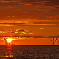 Buy canvas prints of FLAMING RED SKY ( Wind turbines at sea ) by raymond mcbride