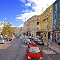 Buy canvas prints of  A high street in Cork City Ireland by Sue Bottomley