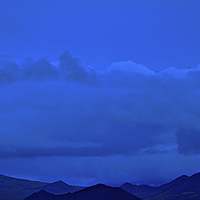 Buy canvas prints of  Blue skies over Silhouetted Mountains in Iceland by Sue Bottomley