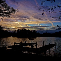 Buy canvas prints of  Sunrise over boating lake by Sue Bottomley