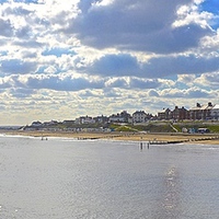 Buy canvas prints of Southwold, beach, beach huts and town  by Sue Bottomley