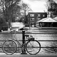 Buy canvas prints of Cycling By The River by Ben Shirley