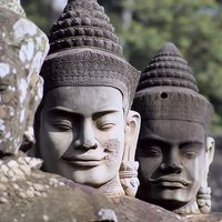 Buy canvas prints of  Angkor Temple Entrance Statue Heads by Brian  Raggatt