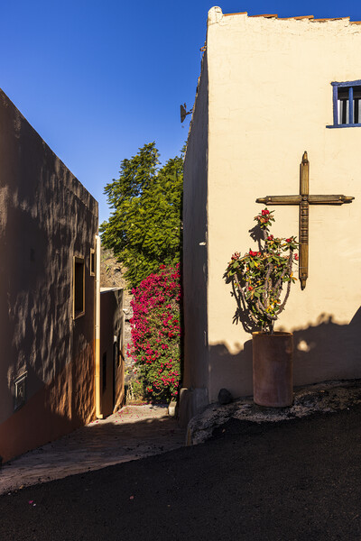 Cross on village wall Tenerife Picture Board by Phil Crean