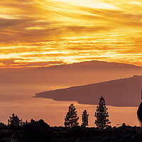 Buy canvas prints of Tourists watch dramatic sunset from Tenerife by Phil Crean