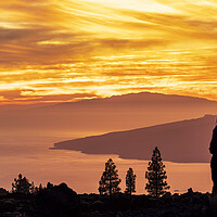 Buy canvas prints of Tourists watch dramatic sunset from Tenerife by Phil Crean