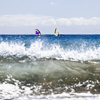 Buy canvas prints of Windsurfers windsurfing on blue seas at El Medano Tenerife by Phil Crean