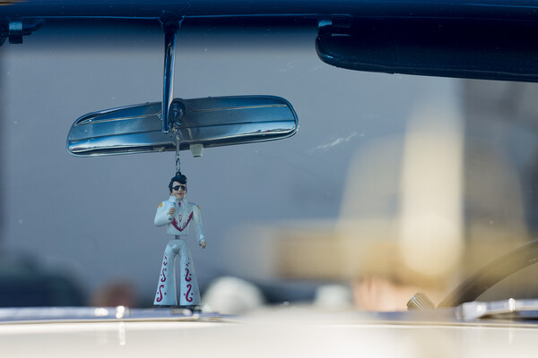 Elvis figure hangs fom rear view mirror Picture Board by Phil Crean