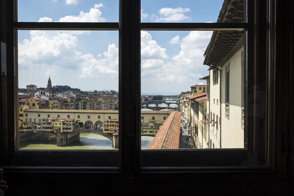 Ponte Vecchio over the river Arno in Florence Picture Board by Phil Crean