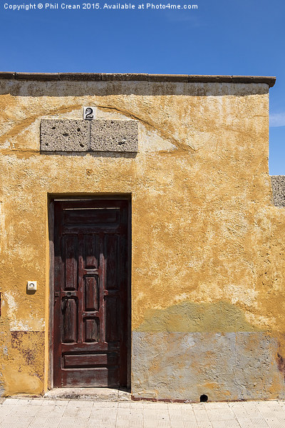  Textured ochre wall, dark red door Tenerife Picture Board by Phil Crean