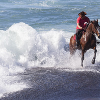 Buy canvas prints of Horseman galloping through the surf II. by Phil Crean