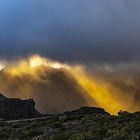 Buy canvas prints of Golden rays of sunshine through the rainclouds by Phil Crean
