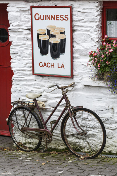 Old Guinness ad and Bicycle, West Cork, Ireland Picture Board by Phil Crean