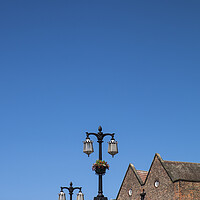 Buy canvas prints of Street lamps against blue sky, York, Yorkshire,  by Phil Crean